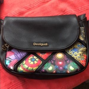 Desigual genuine hand purse with shoulder strap.